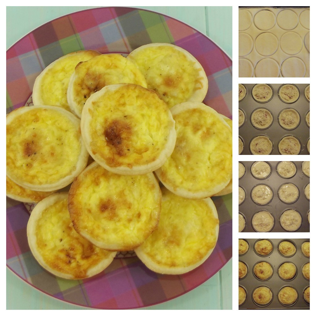 Mini Gruyere Quiches on a tartan patterned plate on an aqua wooden board.