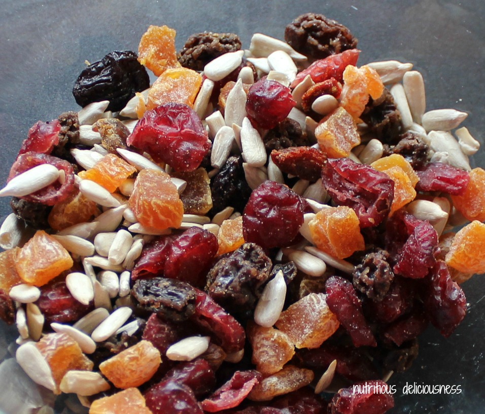 Mixed seeds and dried fruits in a bowl.