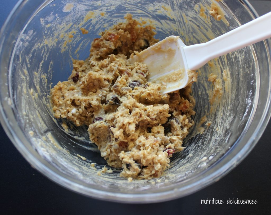 Glass bowl with spatula with cookie dough mixture