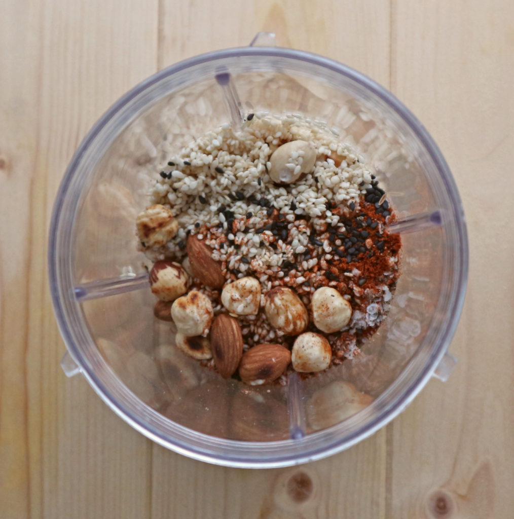 Dukkah ingredients in Nutribullet ready for blending