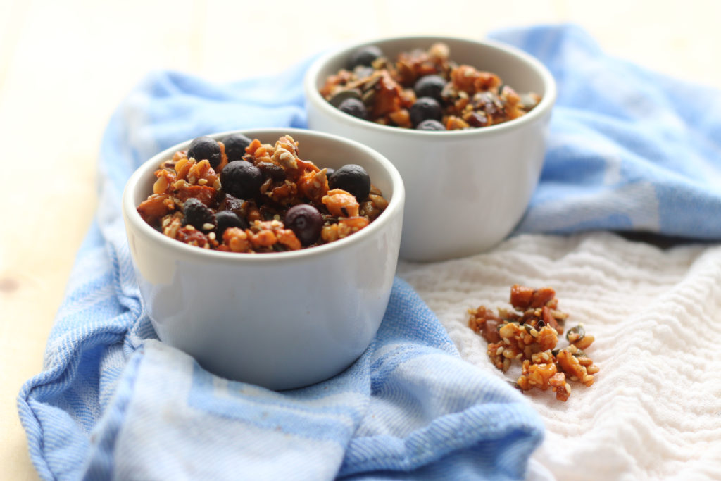Granola in white bowls.