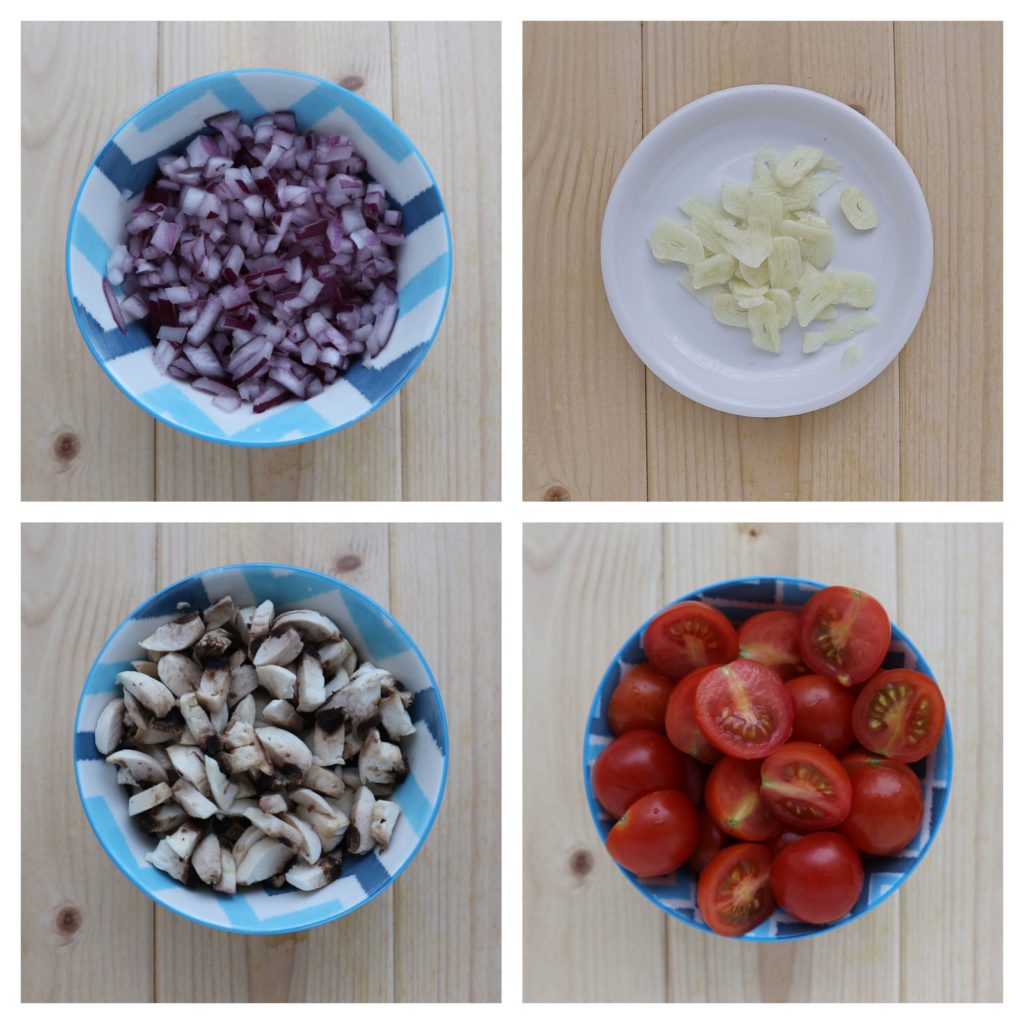 Collage of finely chopped red onions, mushrooms and cherry tomatoes. Sliced garlic on a white saucer. All on a wooden board.