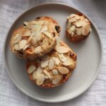 Stollen pastries on a grey plate.