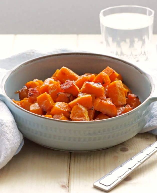 Honey Roasted Butternut Squash in grey bowl with spoon on side