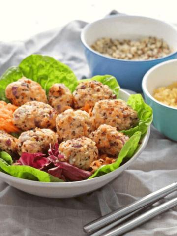 Simple Salmon Bites in white bowl with lettuce
