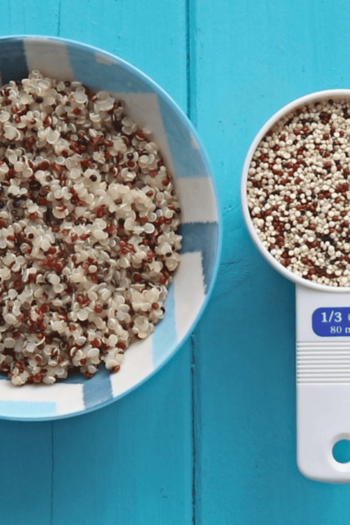 bowl of quinoa next to measuring cup with quinoa