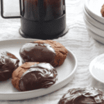Lebkuchen on plates with a cup of coffee and cafetiere.