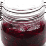 Red cabbage in a sealed glass jar.