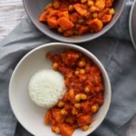 Sweet Potato and Chickpea Curry in a grey bowl with basmatic rice.