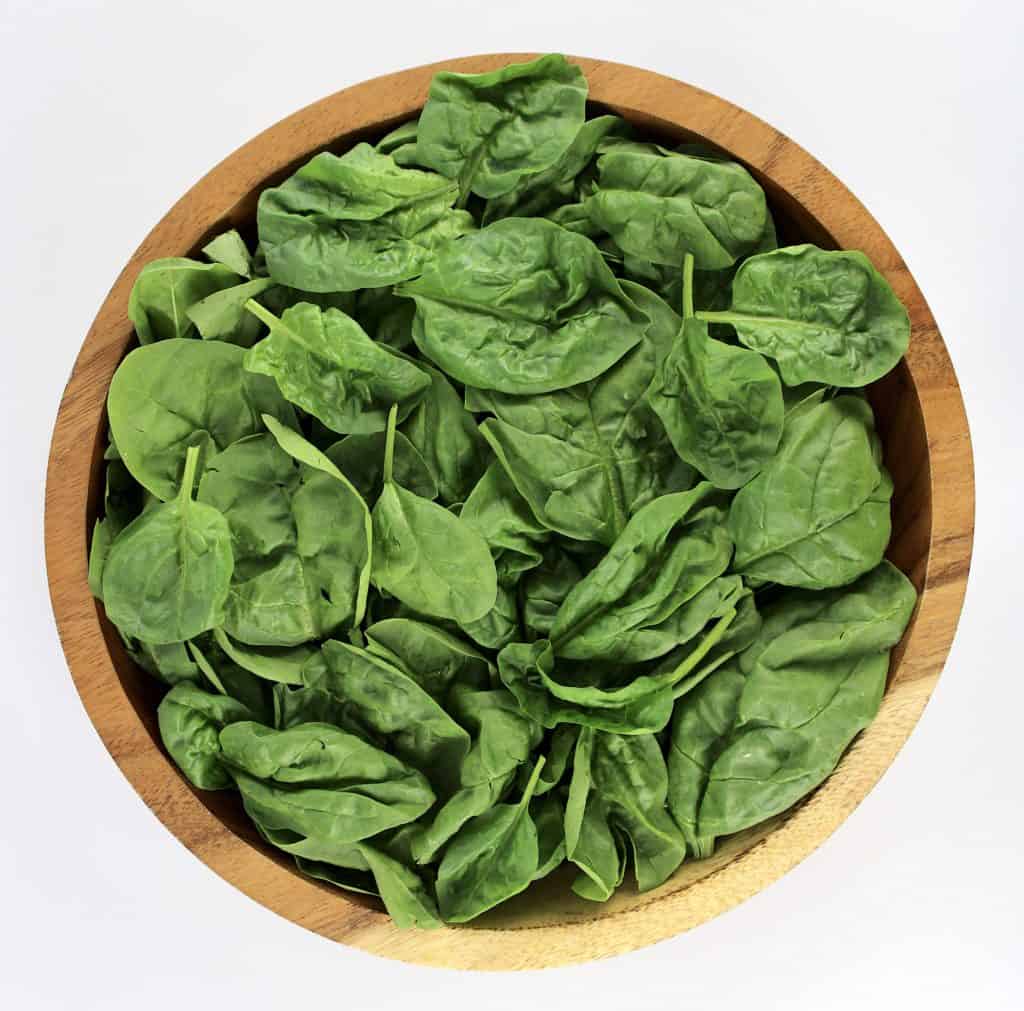 spinach in wooden bowl
