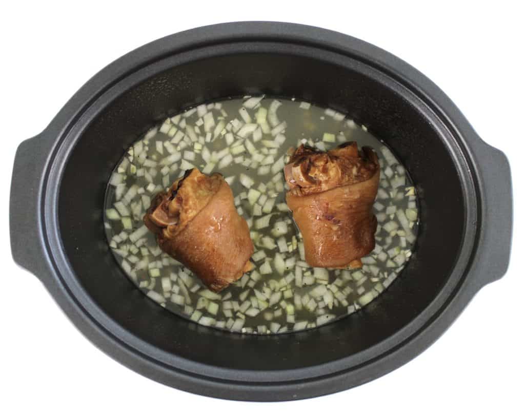 ham hocks, chicken broth and chopped onion in crockpot