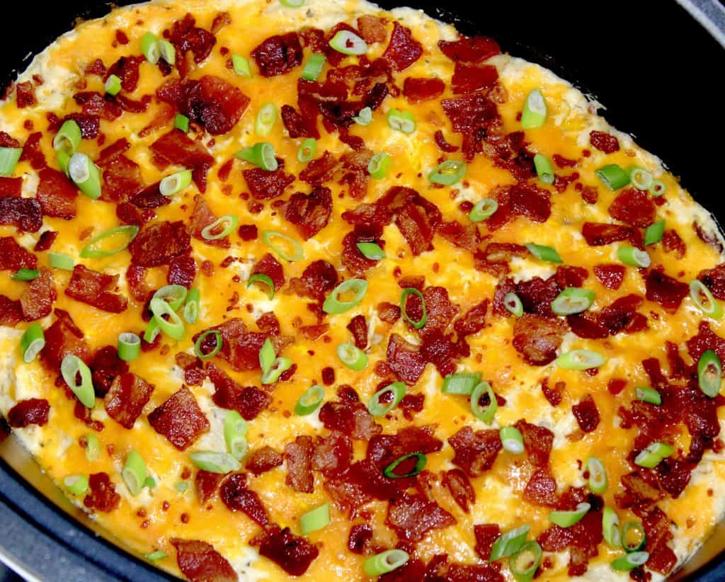 Crock Pot Ranch Chicken with cheese and bacon on top