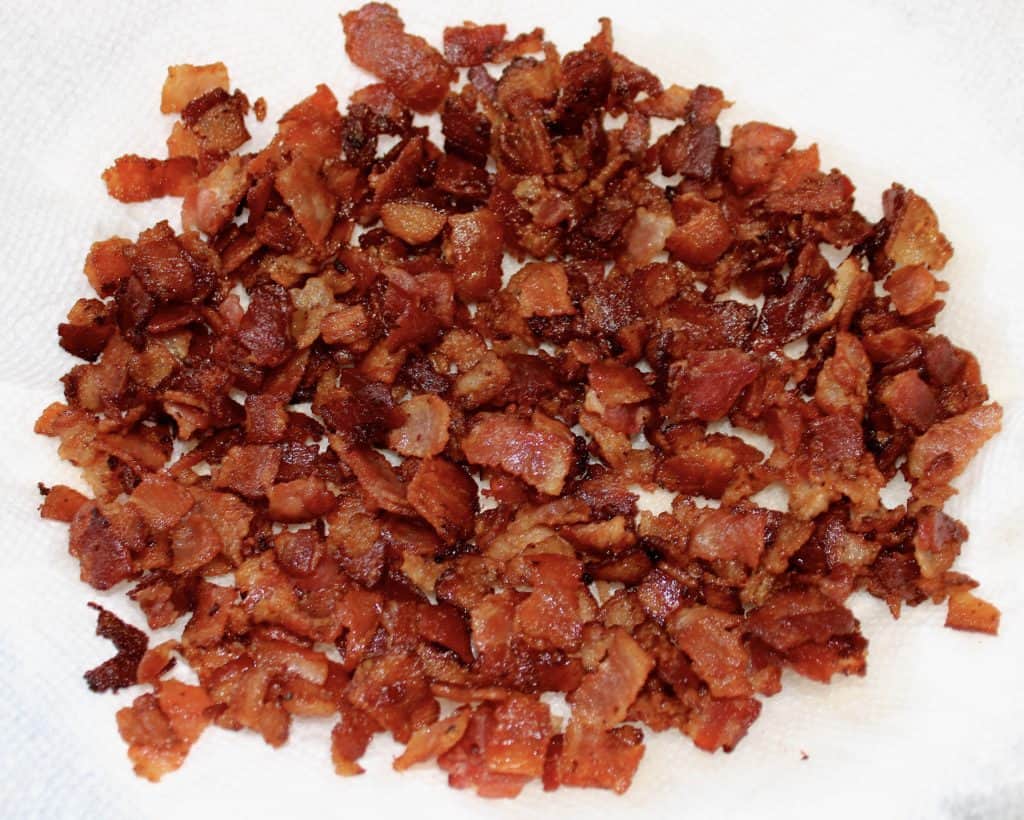 cooked bacon crumbled on paper towels