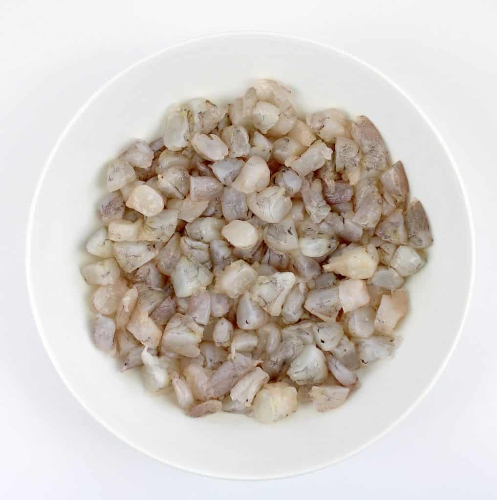 chopped raw shrimp in white bowl