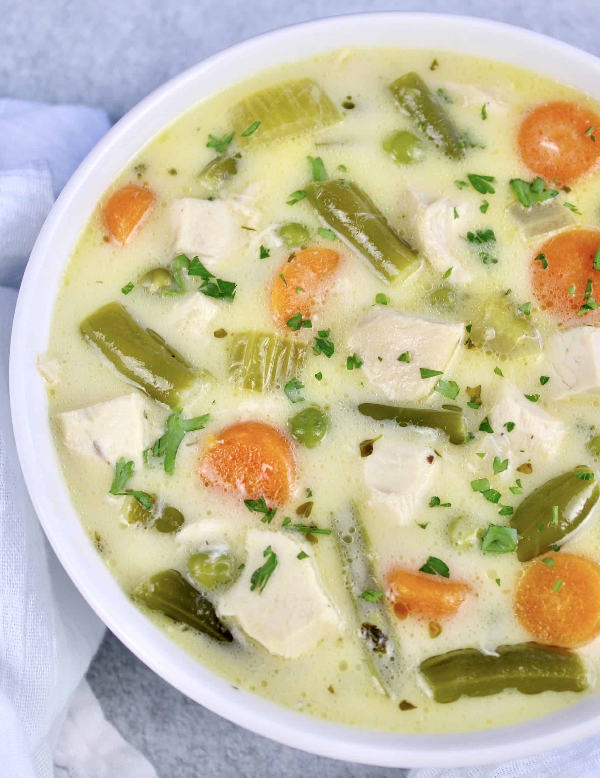 overhead view of Chicken Pot Pie Soup in white bowl