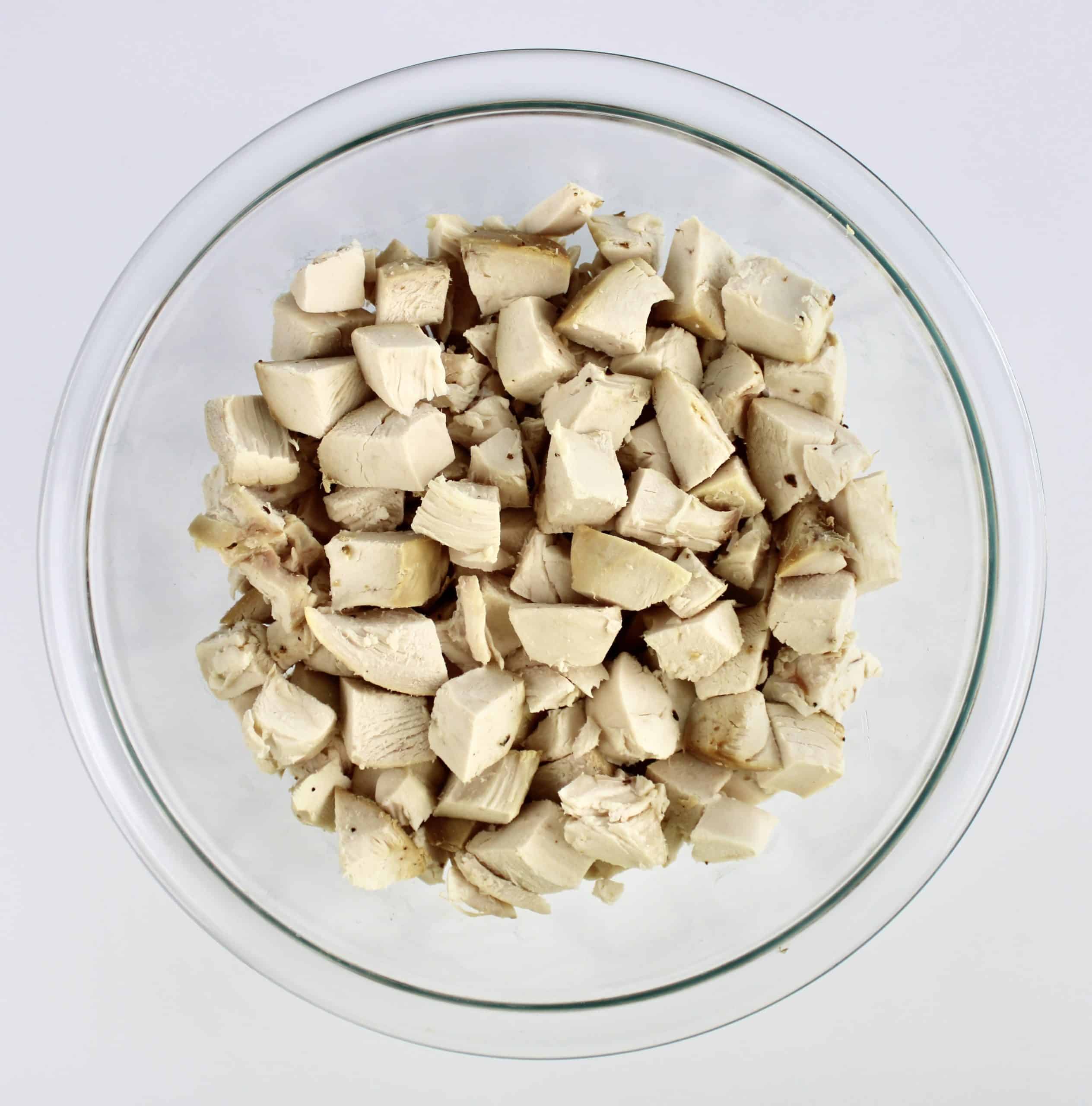 cubed chicken in glass bowl