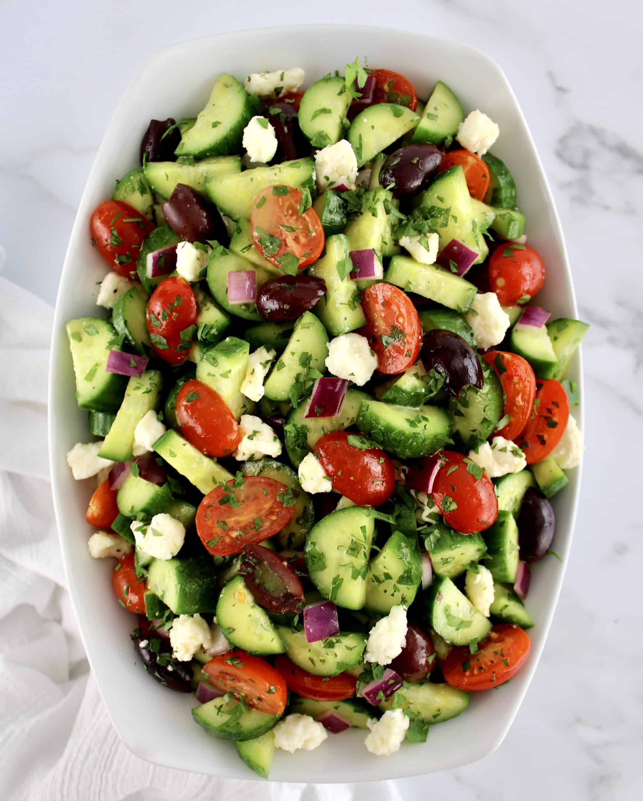 overhead view of Mediterranean Cucumber Salad in white bowl