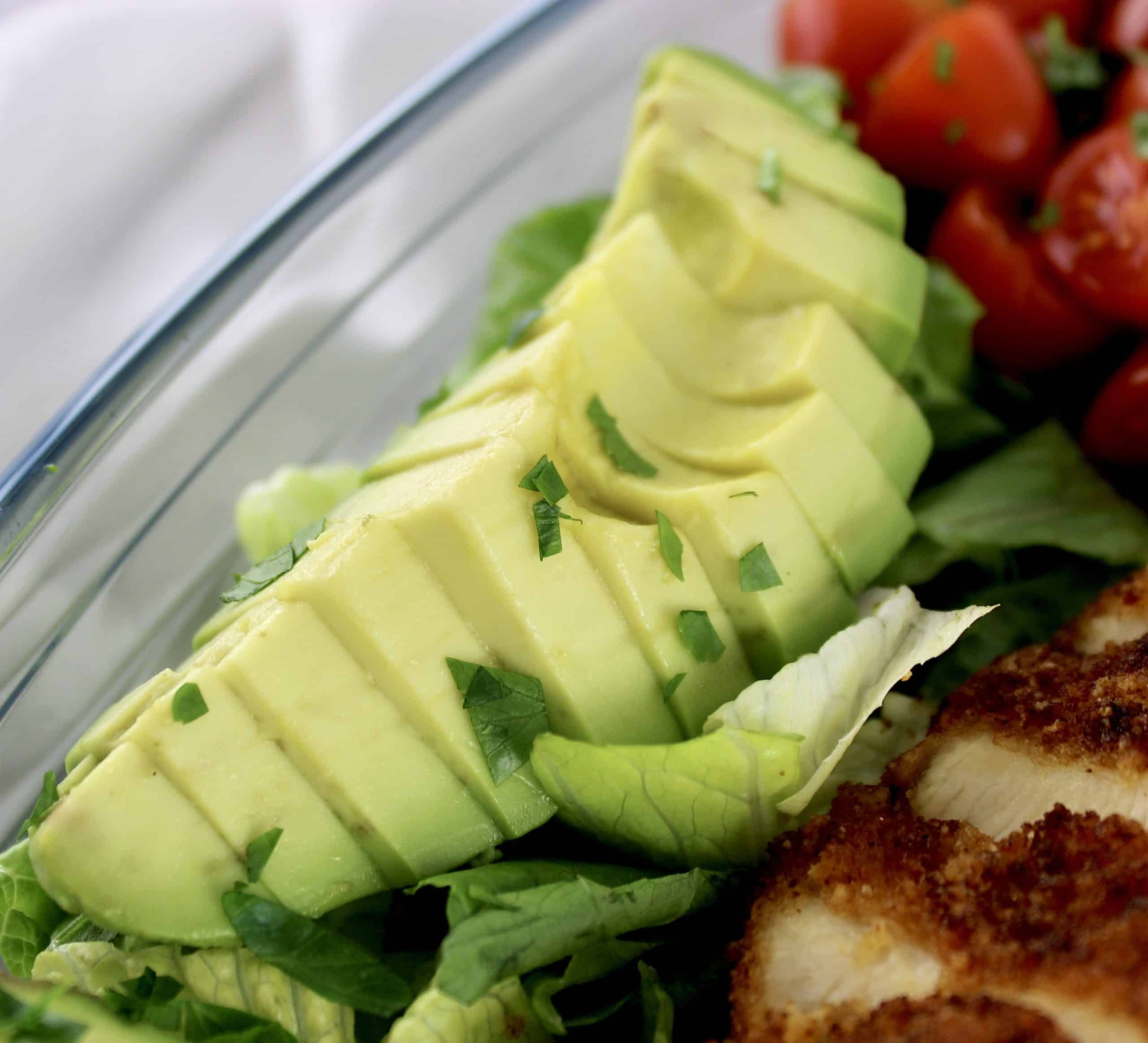 closeup of sliced avocado in salad