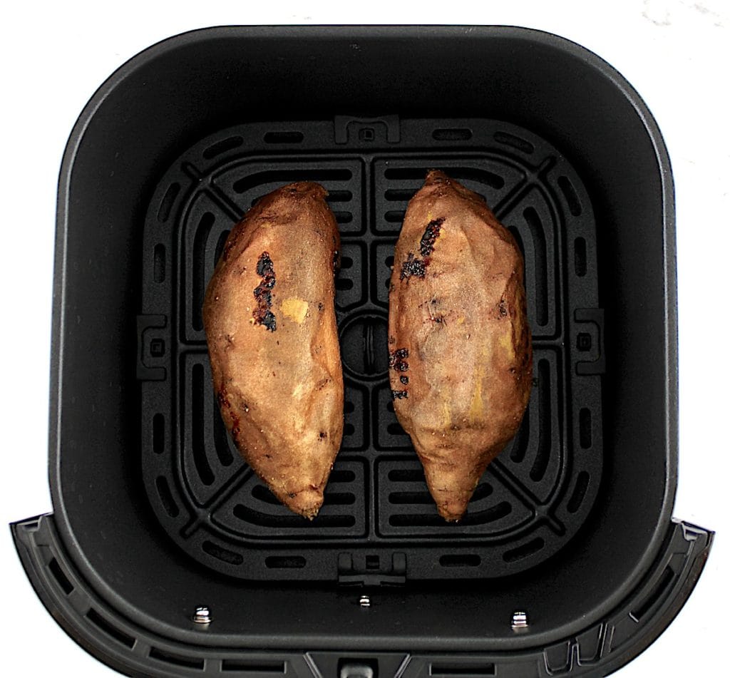 2 cooked sweet potatoes in air fryer basket