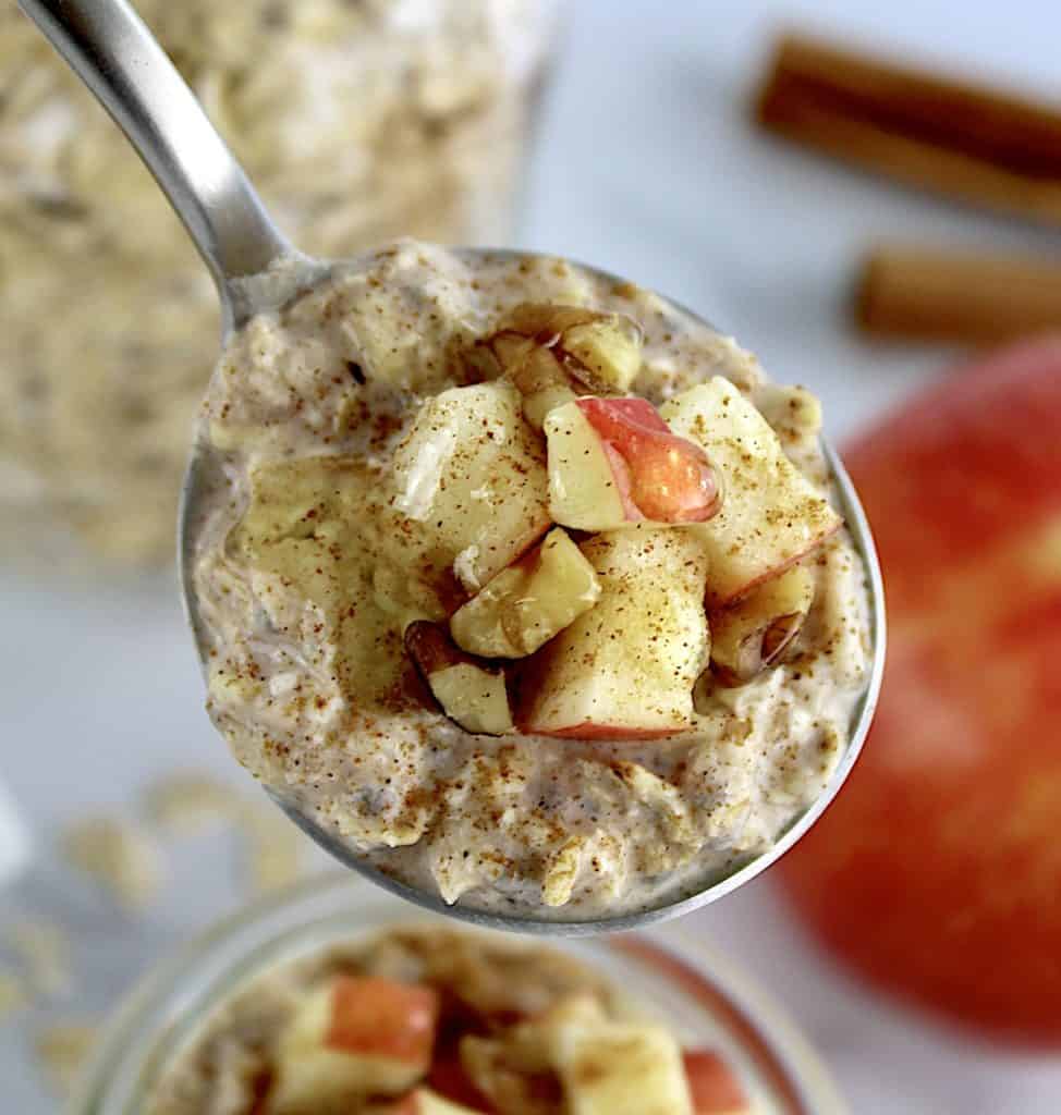 Apple Cinnamon Overnight Oats in spoon with chopped apples 