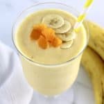 Banana Peach Smoothie with banana slices and peach chunks on top