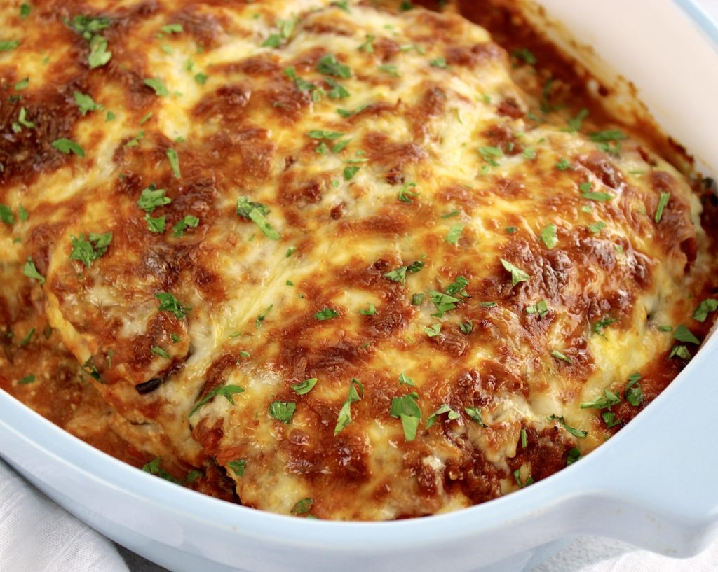 closeup of Eggplant Lasagna in casserole with chopped parsley on top