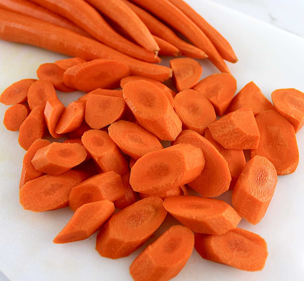 carrots cut on white cutting board