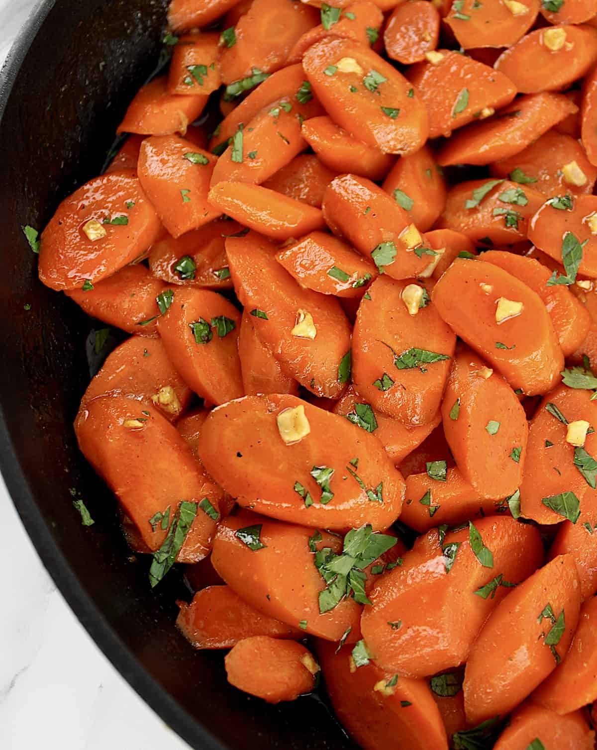 Glazed Carrots in skillet with chopped parsley