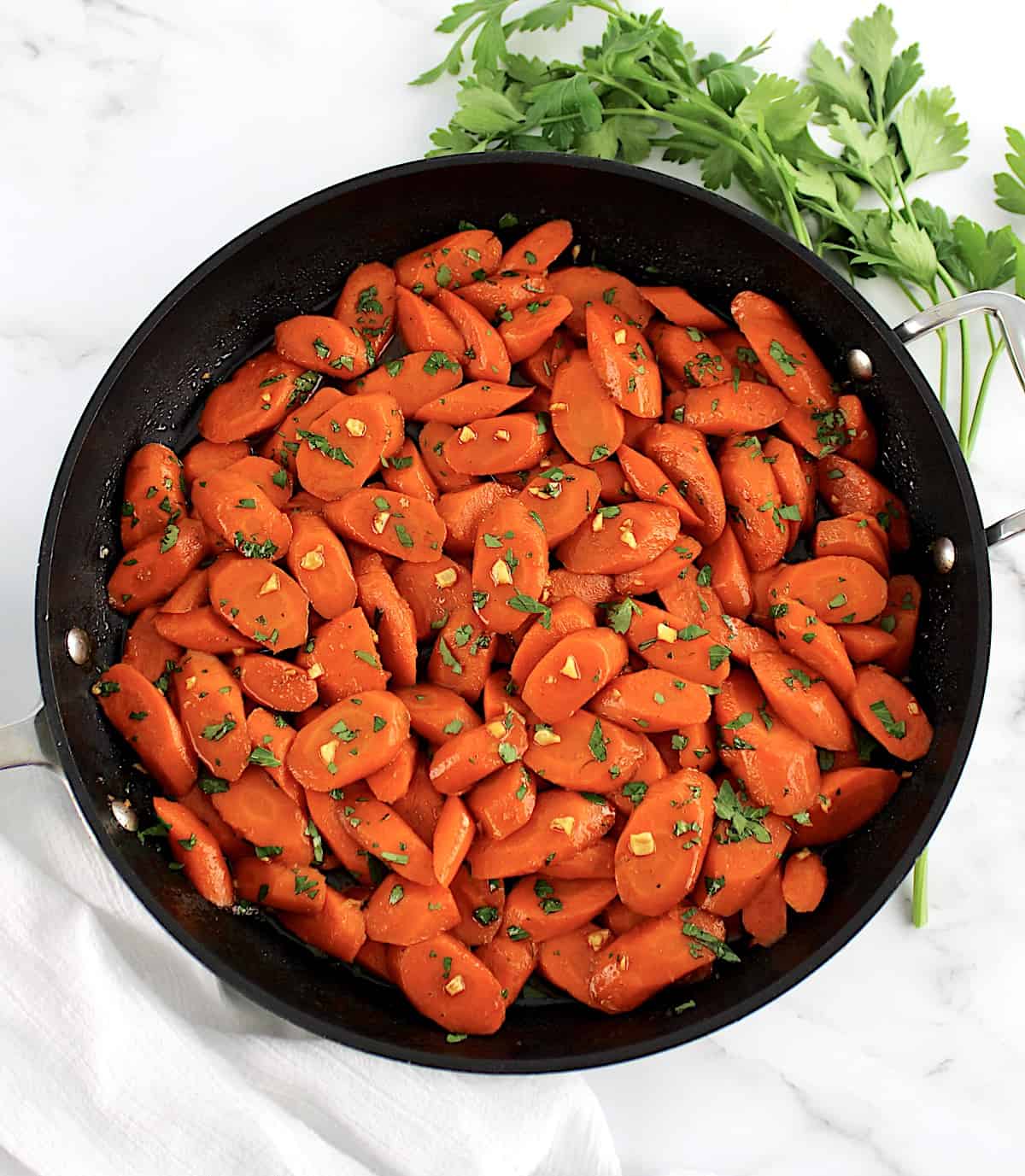 Glazed Carrots in skillet with chopped parsley on top