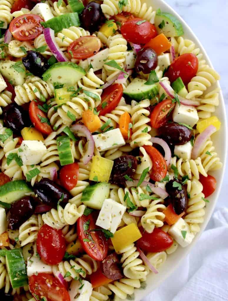 Greek Pasta Salad using rotini pasta with fresh parsley on top