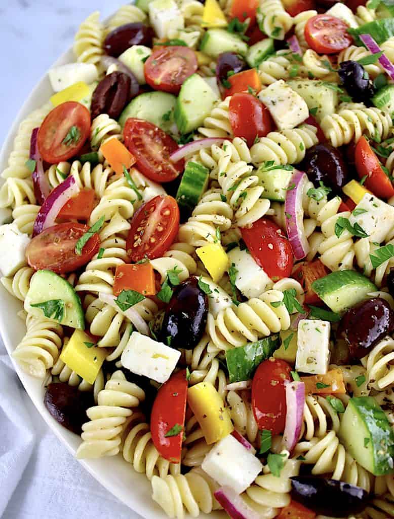 Greek Pasta Salad using rotini pasta with fresh parsley on top