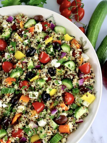 Greek Quinoa Salad with fresh veggies on side