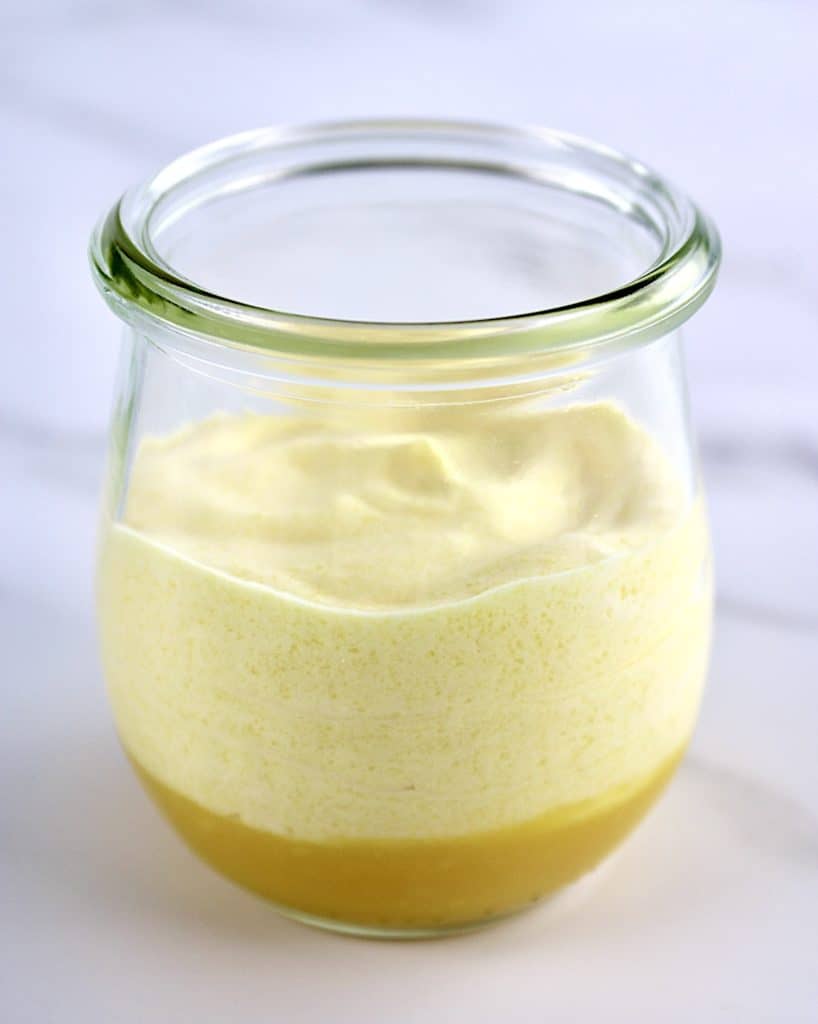 Mango Mousse in glass jar with mango puree on bottom