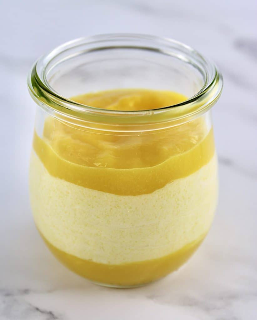 Mango Mousse in glass jar with mango puree on bottom and top