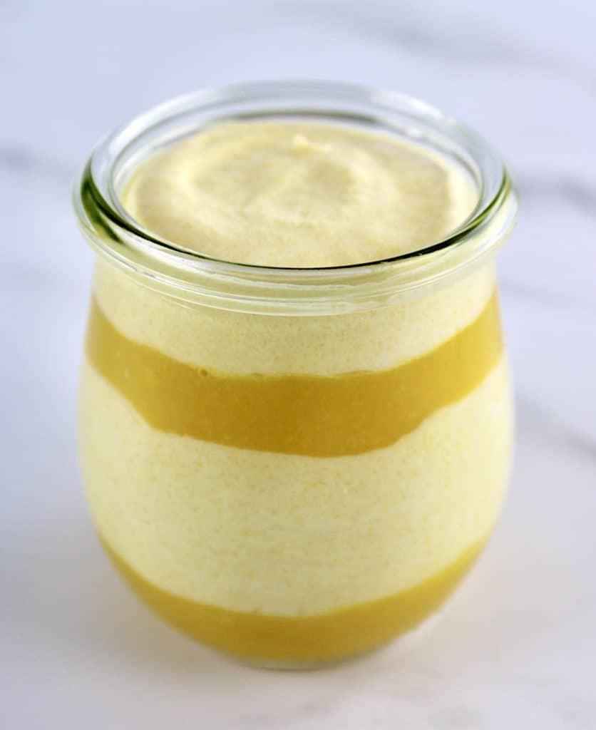 Mango Mousse in glass jar with mango puree on bottom