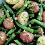 closeup of Garlic Potatoes and Green Beans with chopped parsley on top