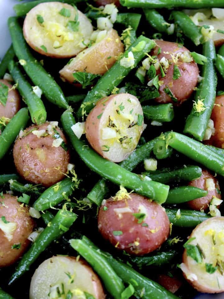 closeup of Garlic Potatoes and Green Beans with chopped parsley on top