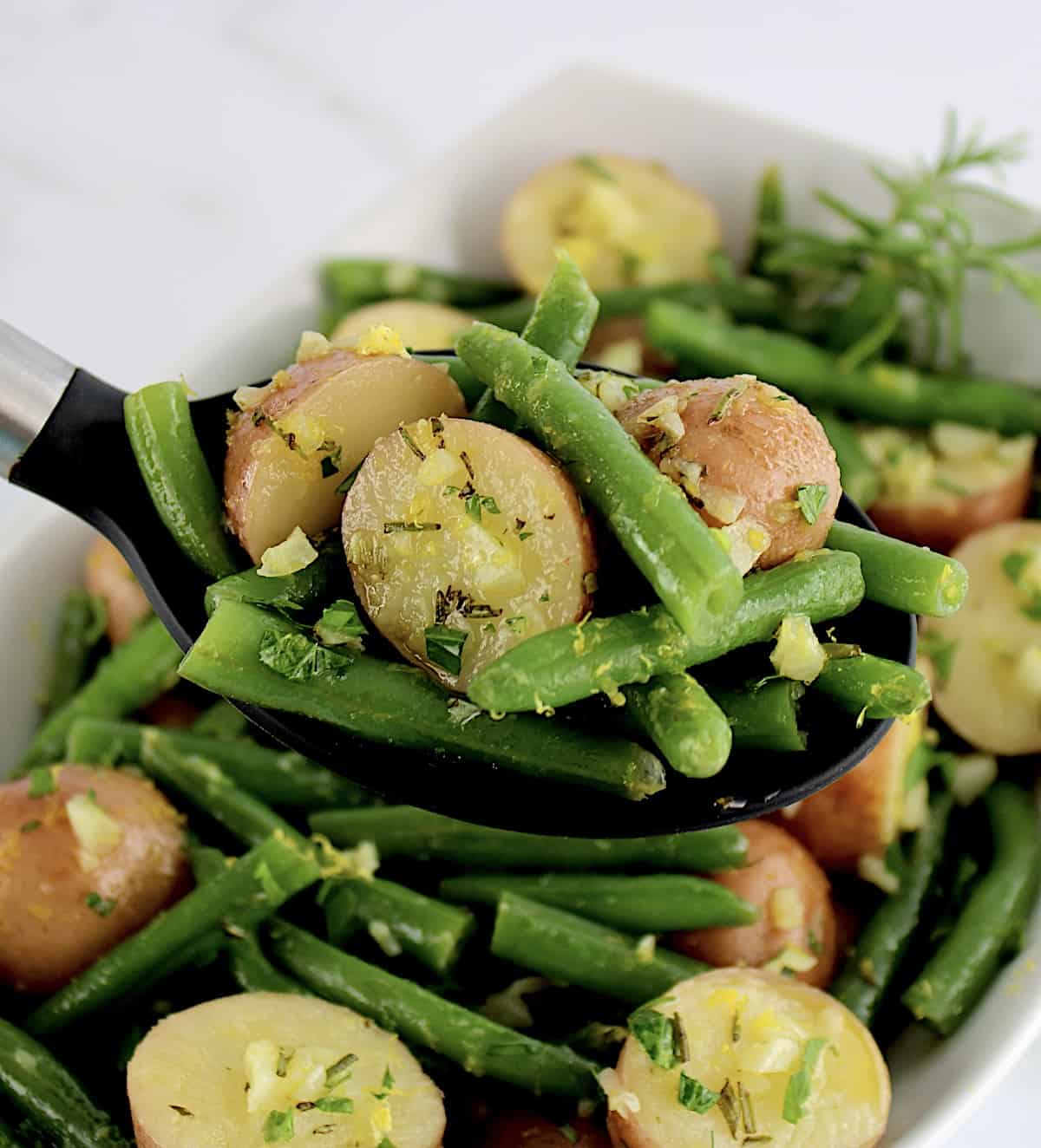 Garlic Potatoes and Green Beans in serving spoon