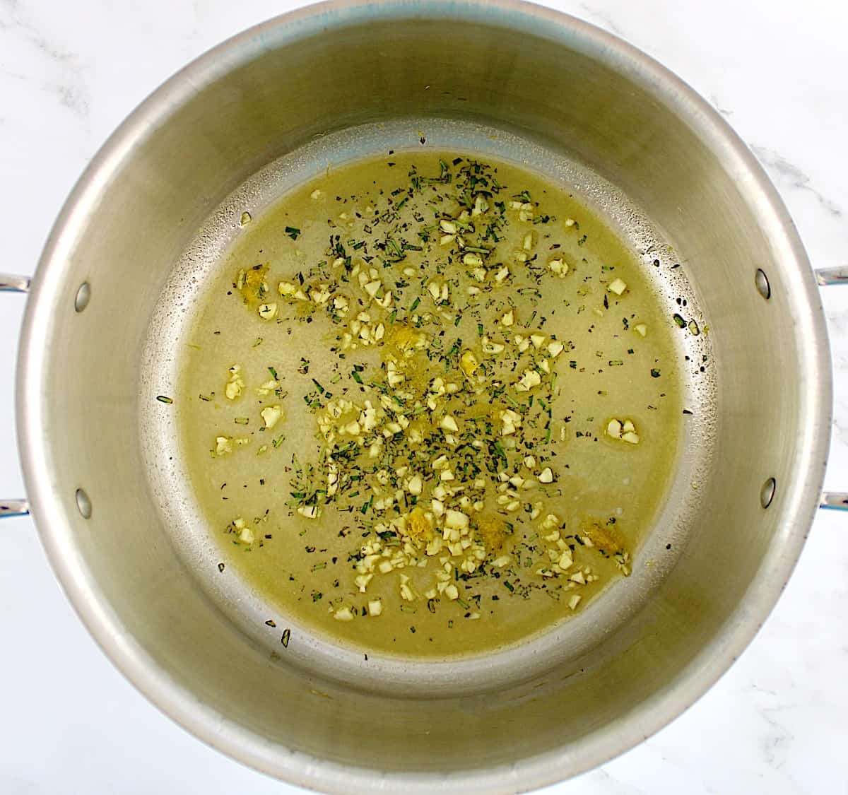 melted butter, garlic, rosemary and lemon zest in saucepan