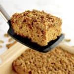 Gluten-Free Apple Cake slice held up by spatula