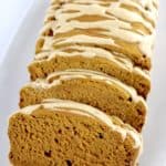 Gluten Free Pumpkin Bread with maple icing on top and a few slices cut