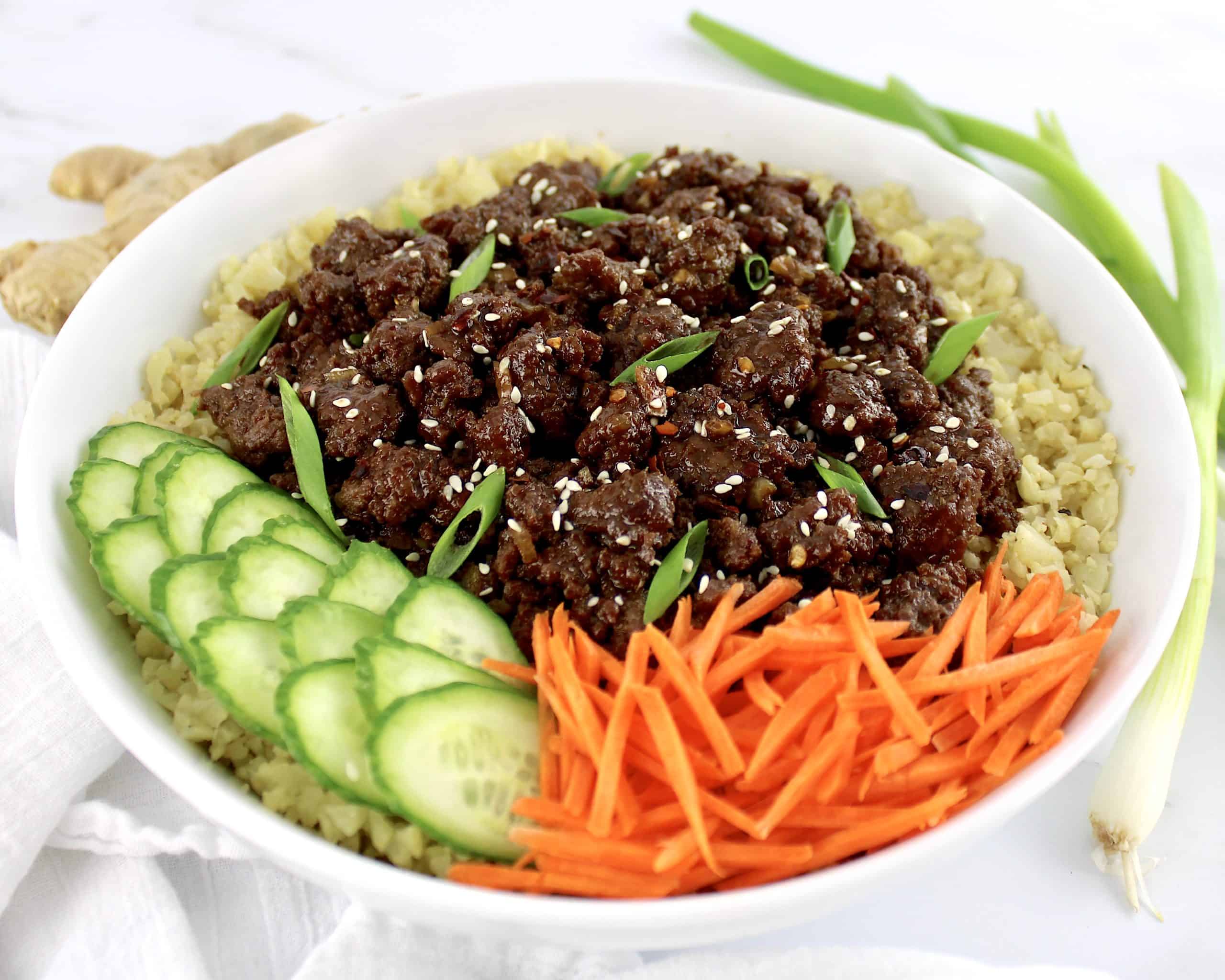 Korean Beef Bowl with sliced scallions and sesame seeds