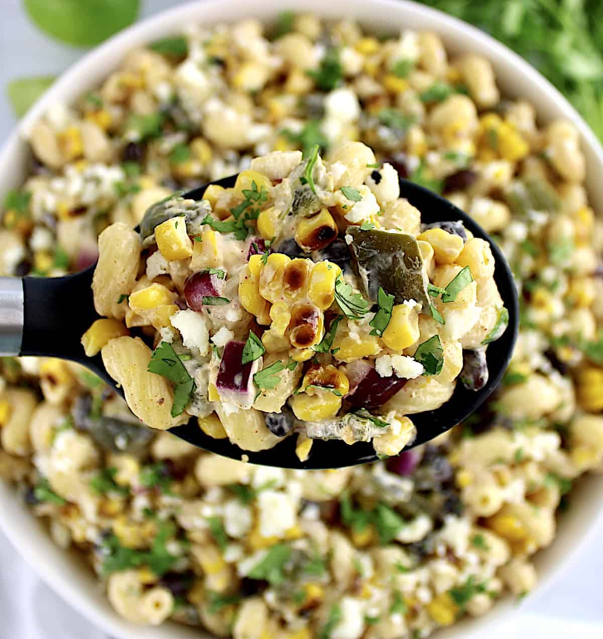 spoonful of Mexican Street Corn Pasta Salad over bowl