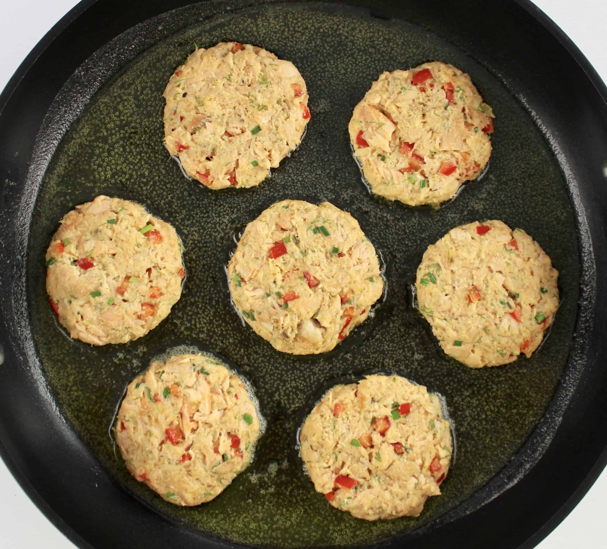 7 salmon patties raw inn skillet