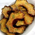 Air Fryer Acorn Squash slices on white plate