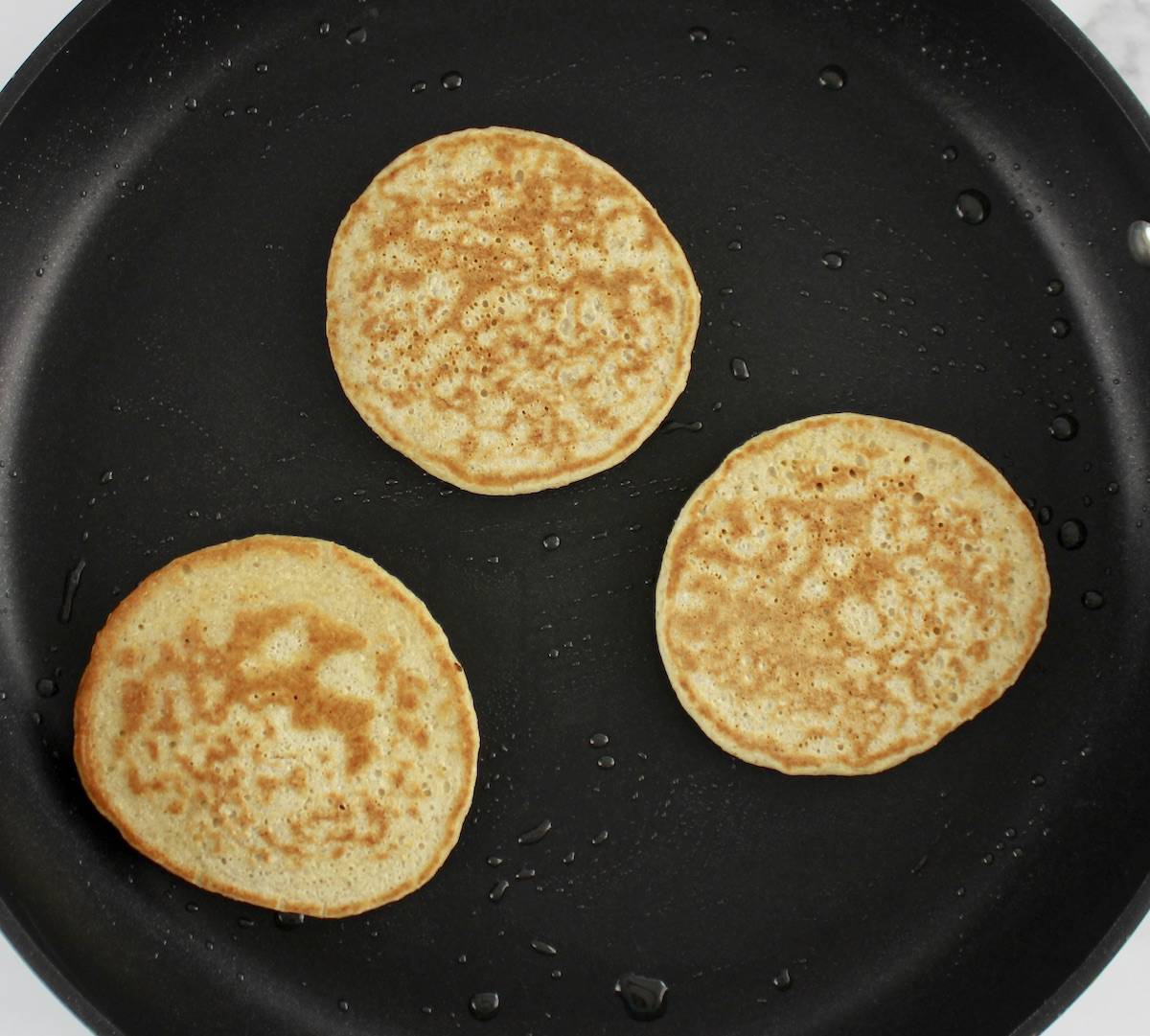 3 Banana Oat Flour Pancakes in skillet