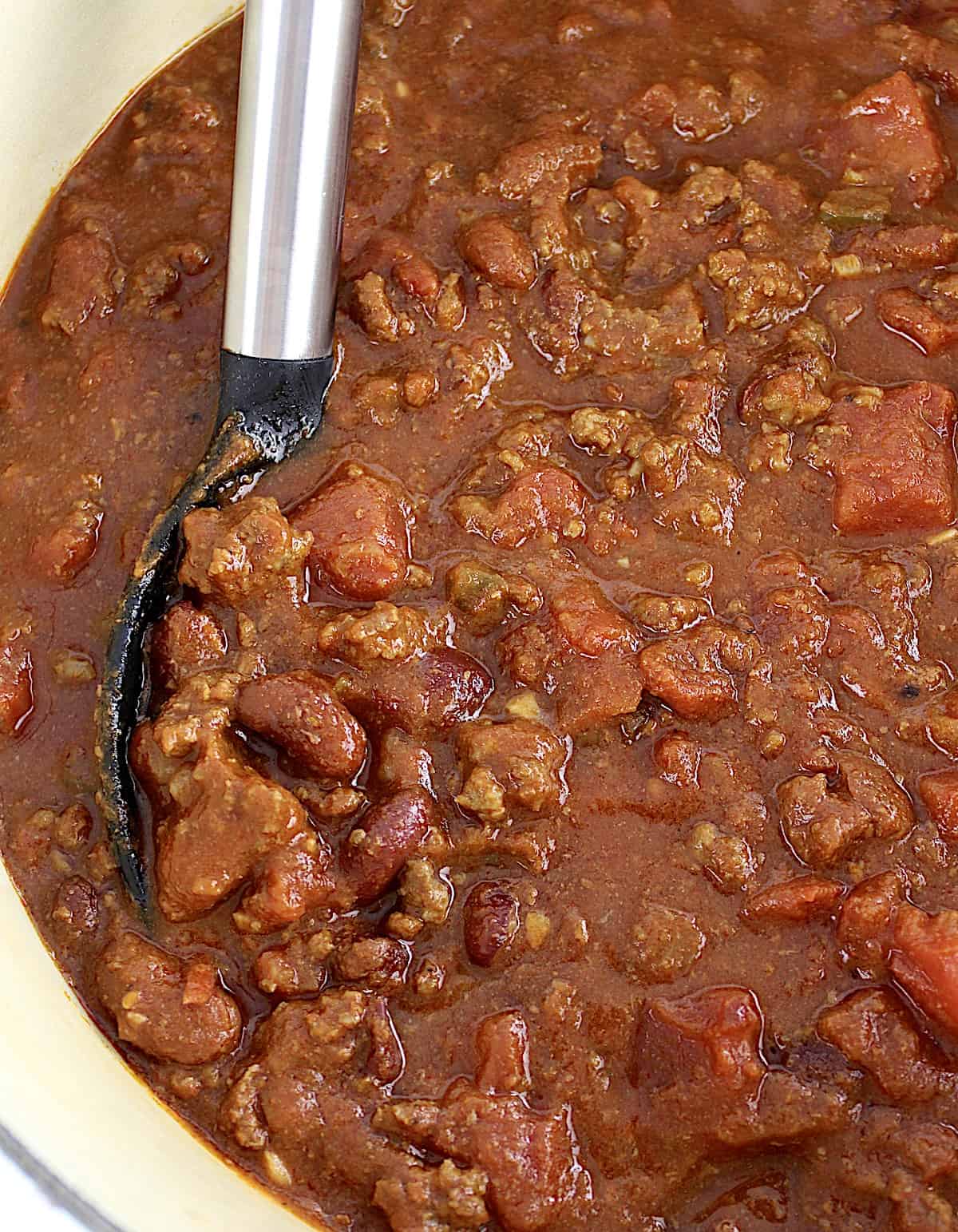 Best Homemade Chili in pot with large serving spoon