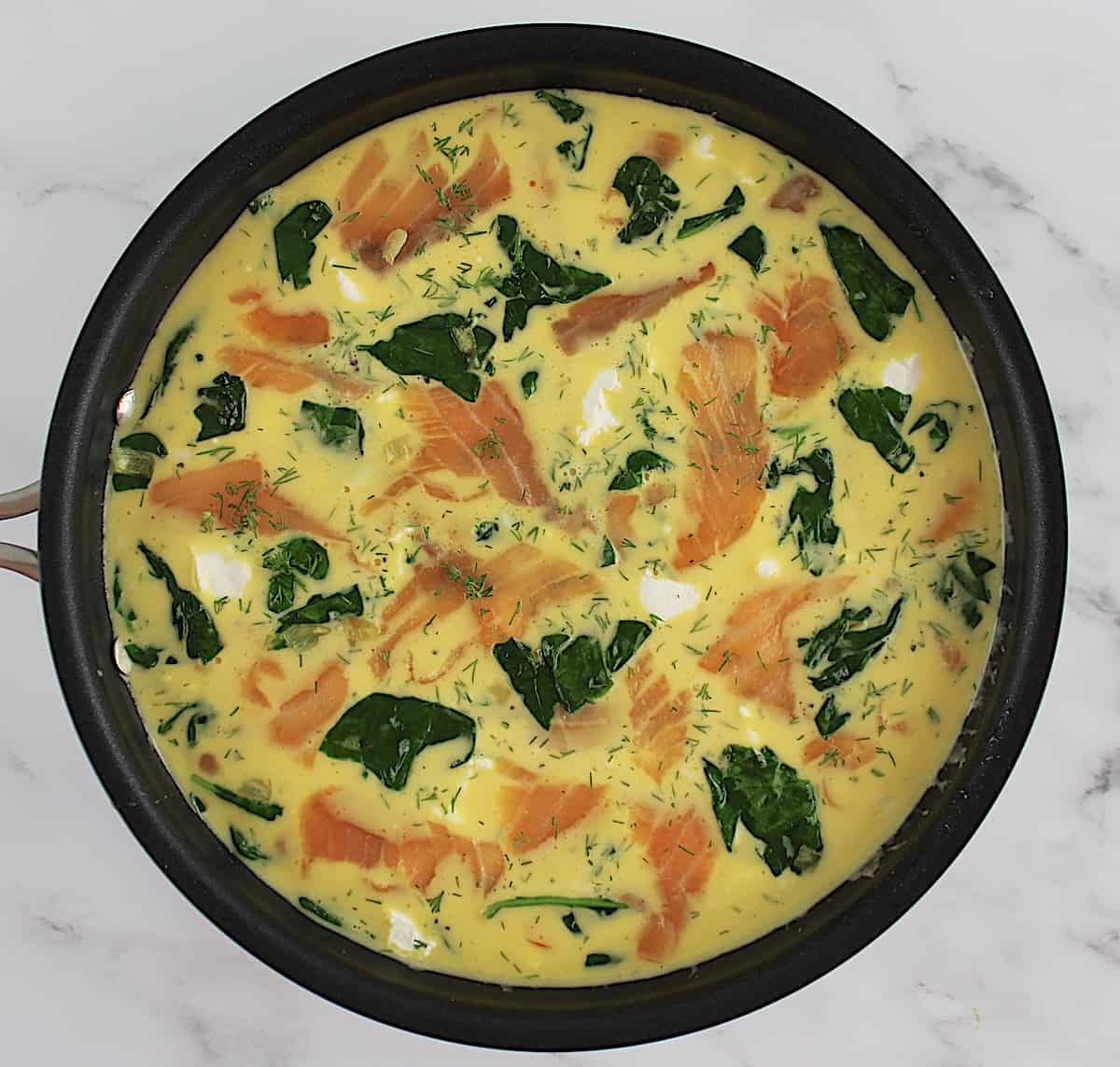Smoked Salmon Frittata uncooked in skillet