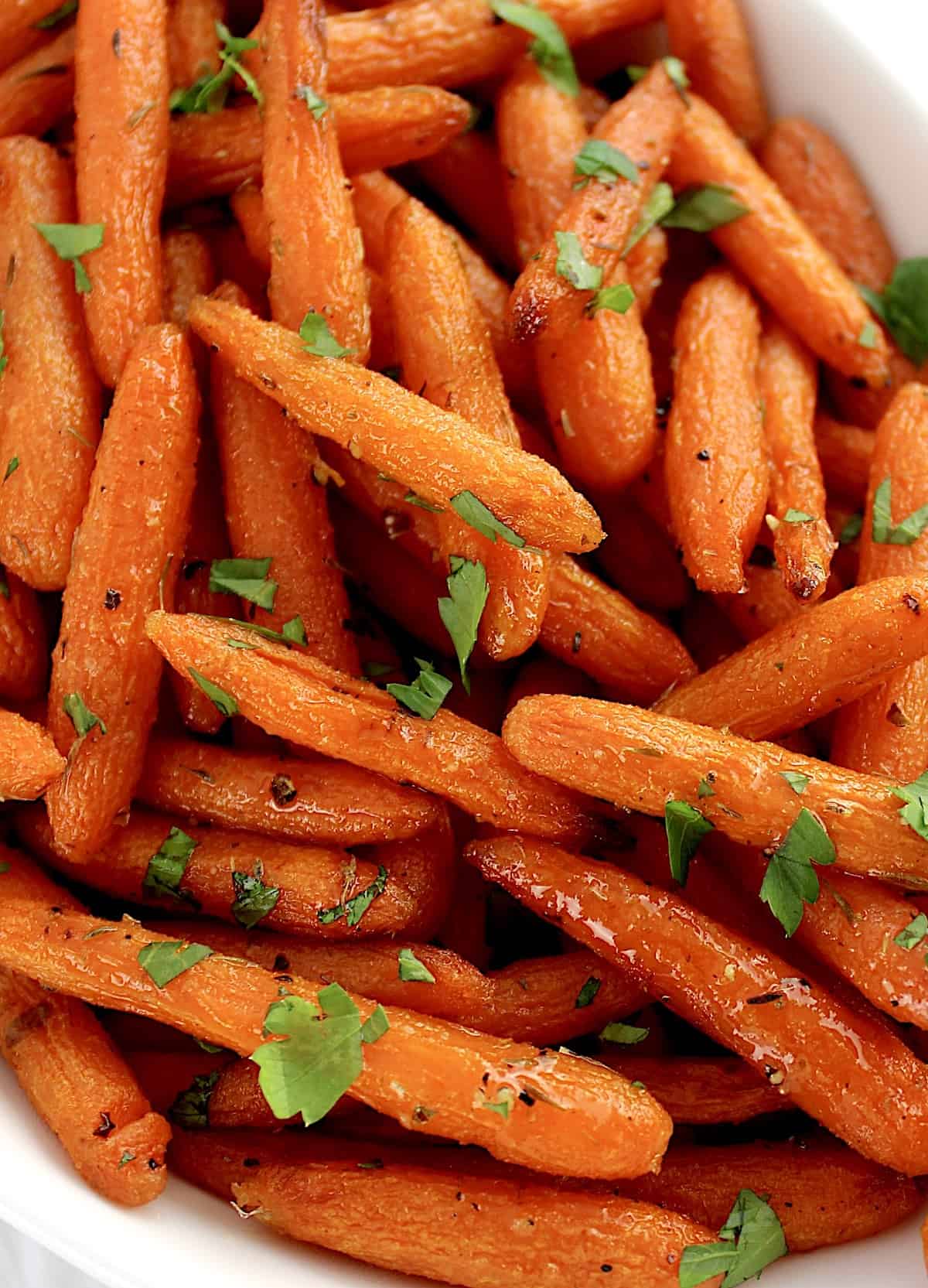 closeup of Air Fryer Baby Carrots with chopped parlsey