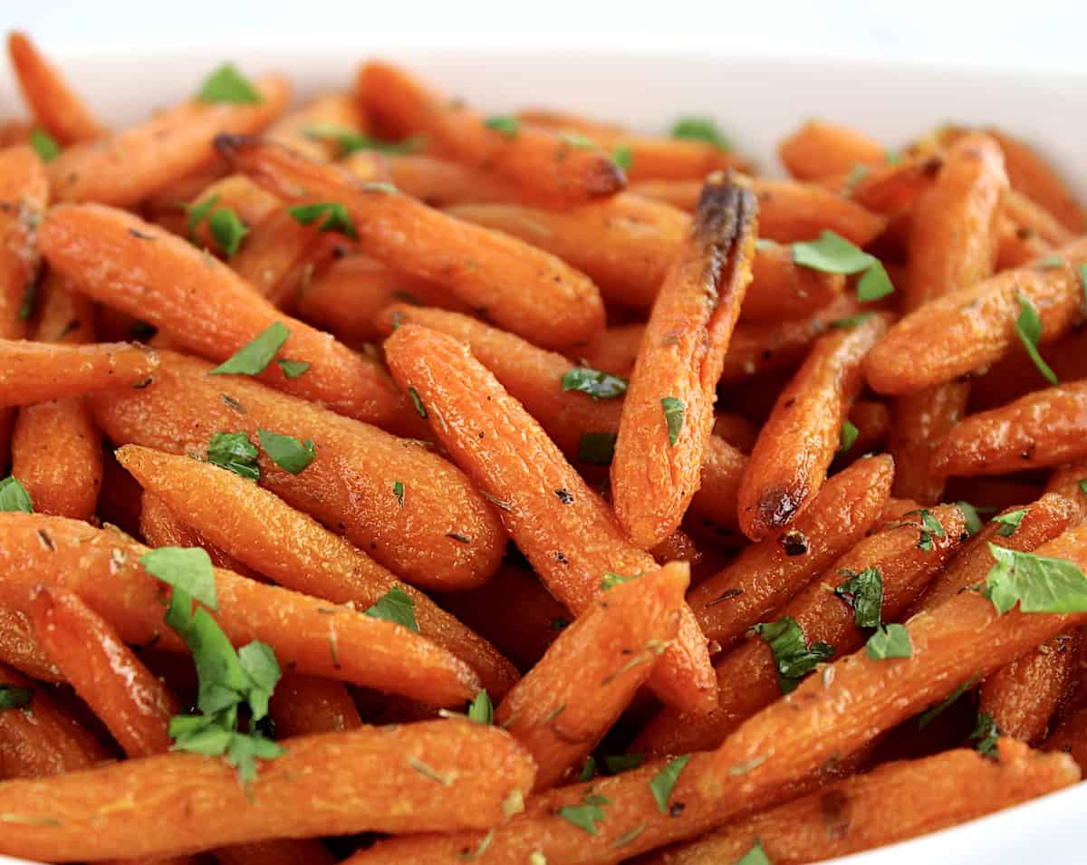 closeup of Air Fryer Baby Carrots with chopped parsley